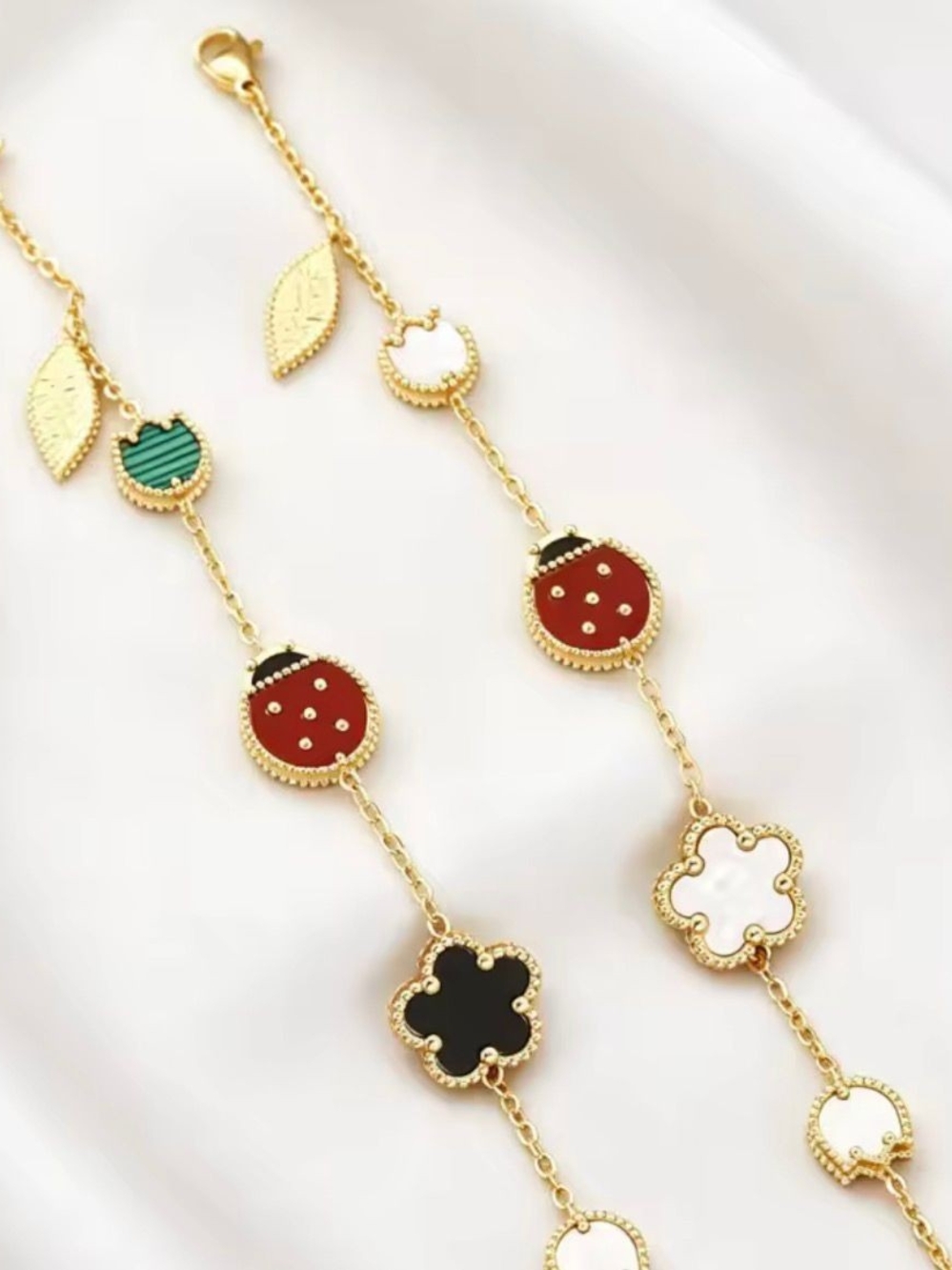 Luxury Gold-Tone Women’s Charm Necklace with Red, Black & Green Enamel Accents - Picture 4 of 4